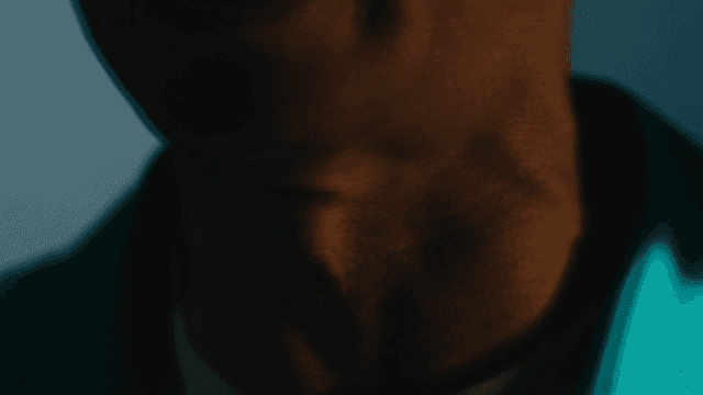 Old man in turquoise shirt