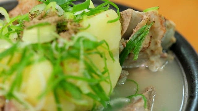 Braised pork backbone with clear soup in an hot pot