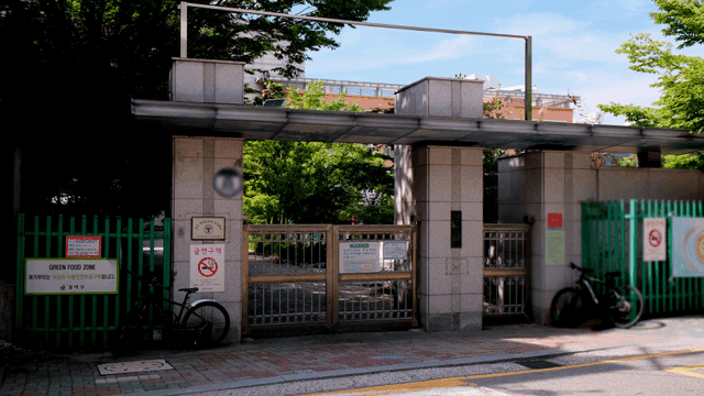 Main entrance to school where bicycles are parked