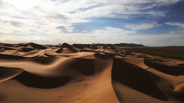 Vast desert landscape under a blue sky