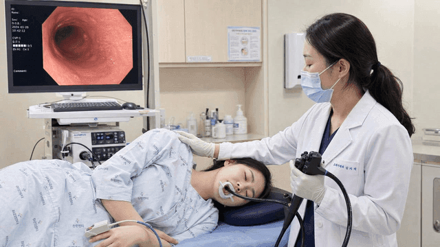 Doctor performing endoscopy on patient