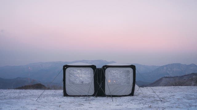 Camping in a snow-covered mountainous landscape