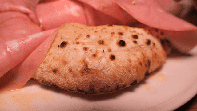 Wood-fired pizza with mortadella and burrata