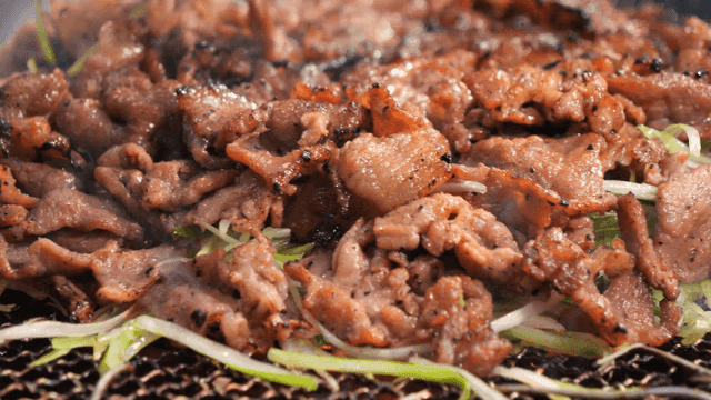 Sizzling charcoal-grilled green onion bulgogi from barbecue