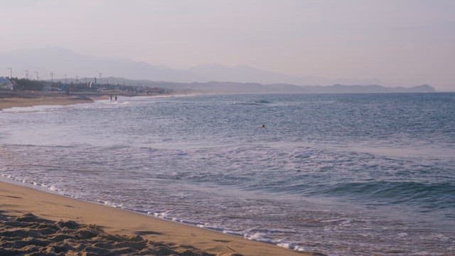 Tranquil Beach Morning with Gentle Waves