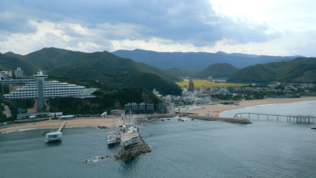 Coastal resort with mountains and sea