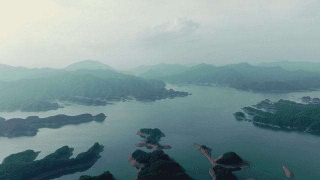 Tranquil lake surrounded by mountains