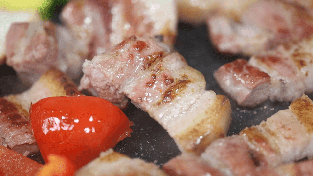 Grilled pork and vegetables sizzling
