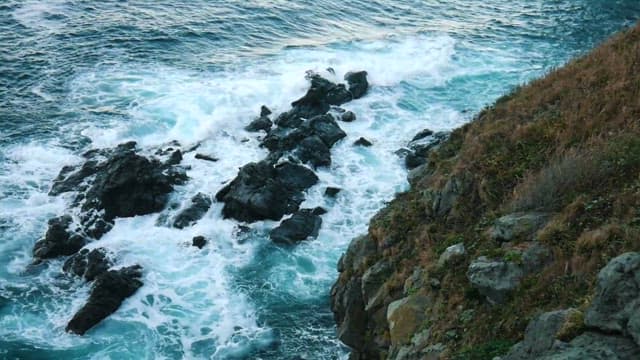 Coastal Cliffs and Waves at Twilight