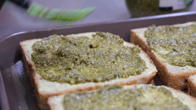 Chef preparing sandwiches with various fresh ingredients
