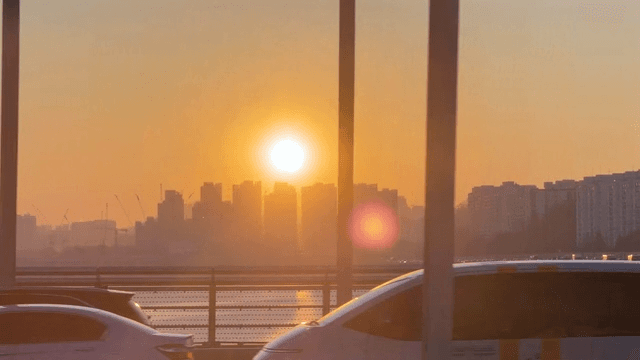 Sunset view over a busy city bridge