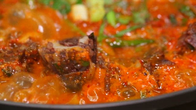 Boiling stew made with sundae, mushrooms, and vegetables