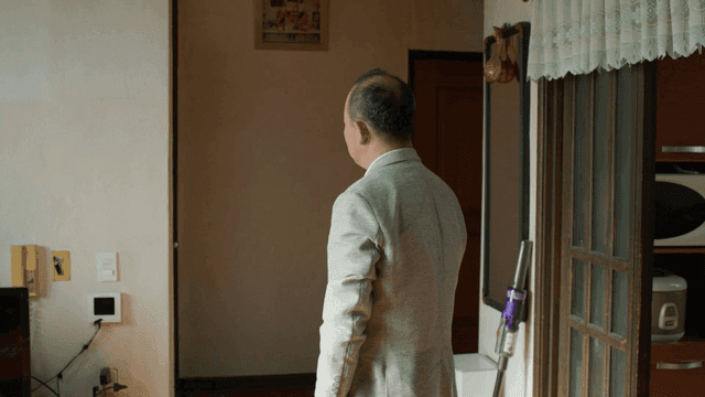 Father helping son with tie in the morning