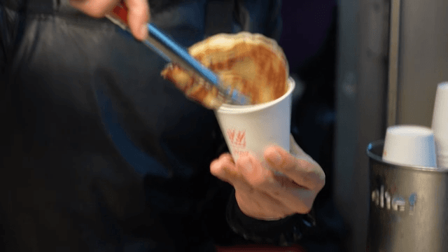 Warm hotteok served in paper cup