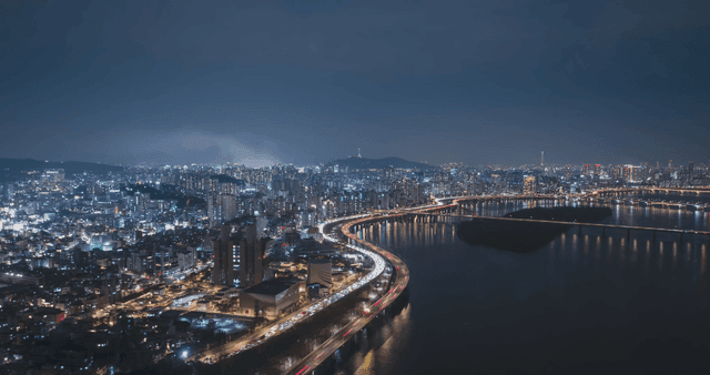 Bustling city skyline at night.