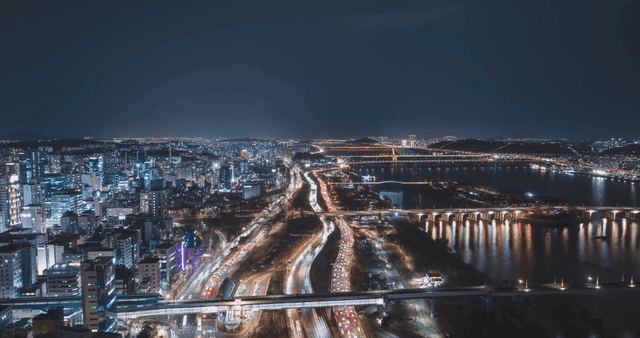 Night view of a bustling city with traffic