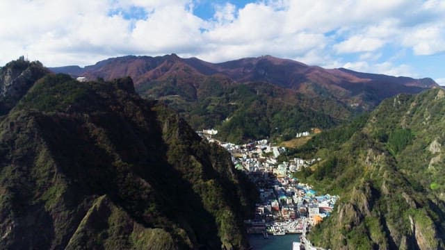 Aerial View of a Town Nestled in Mountainous Landscape