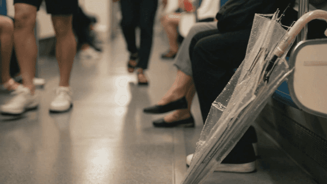 Subway interior with an umbrella on the floor