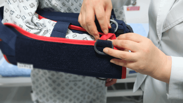 Patient wearing medical arm brace