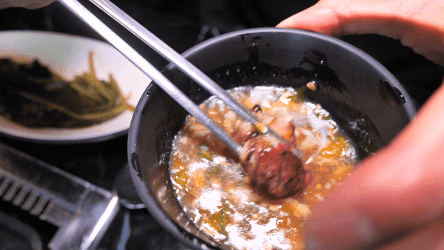 Meal of meat dipped in soy sauce