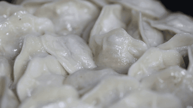 Steamed dumplings glistening with moisture