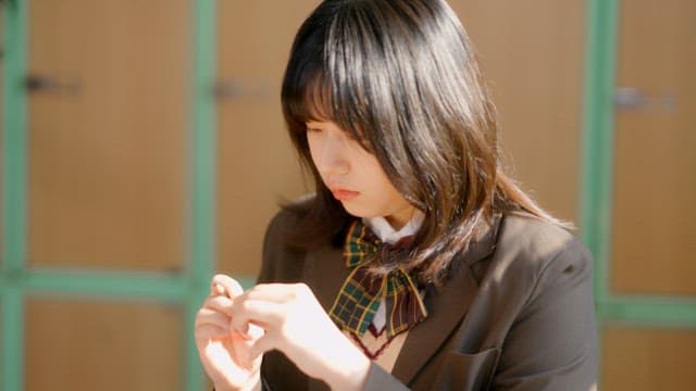 Student studying at a desk in a classroom