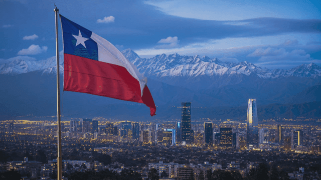 Night city skyline and Chilean flag
