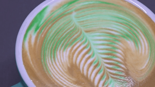 A cup of coffee with intricate latte art