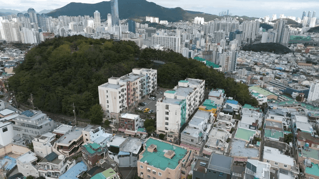 High hill villa village with surrounding green space