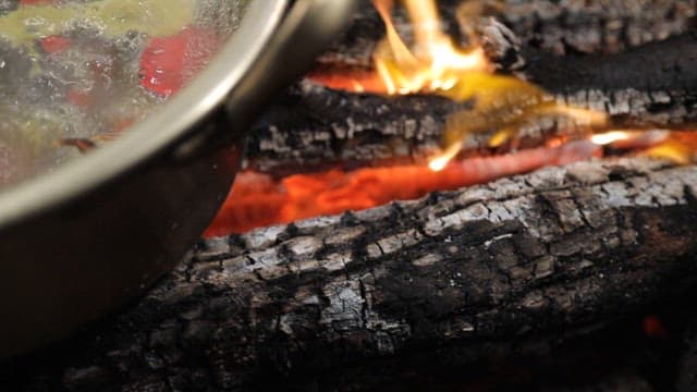 Crab dish cooked over a blazing charcoal fire