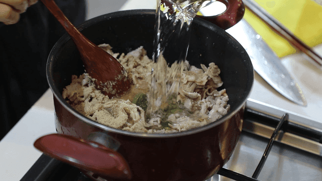 Meat broth cooking in pot