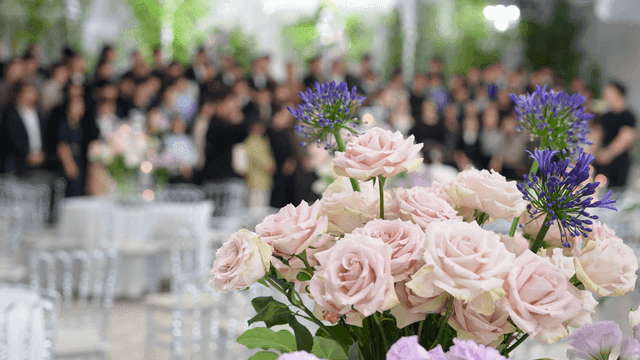 Elegant floral arrangement in front of wedding photographers