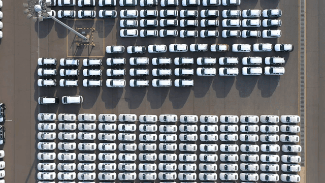 Rows of parked cars in a large lot