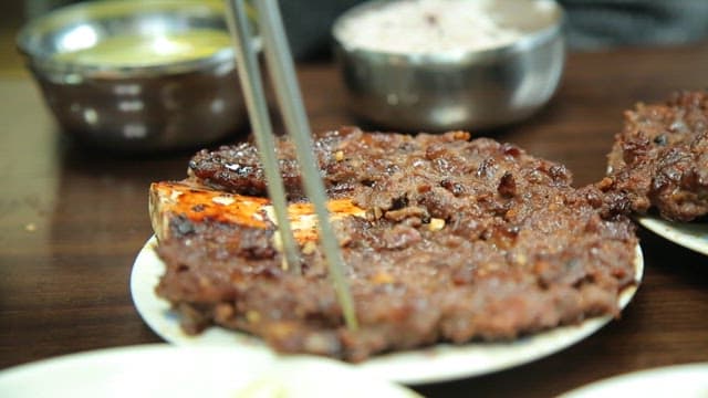 Juicy tteokgalbi on a plate