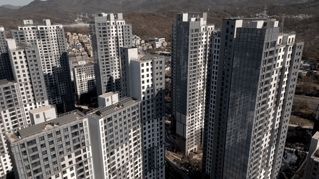 Modern high-rise buildings with mountains