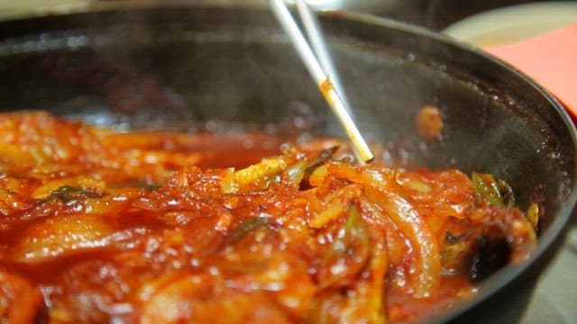 Spicy braised half-dried pollack simmering in a pot