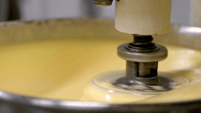 Mixing yellow dough with large mixer