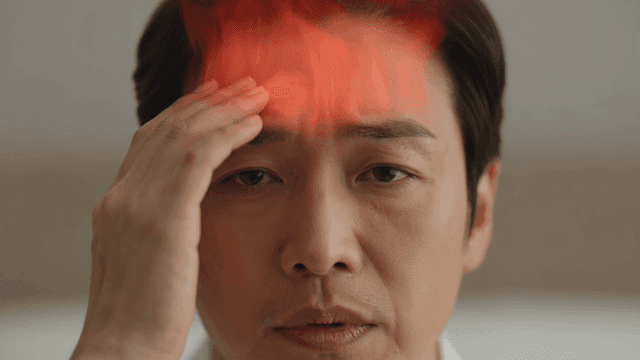 Man suffering from severe headaches