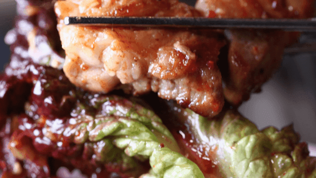 Grilled meat wrapped in fresh lettuce