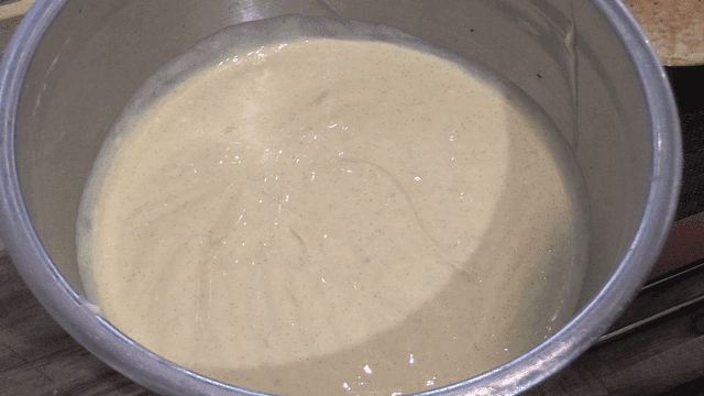Pie cream in stand bowl on wooden table
