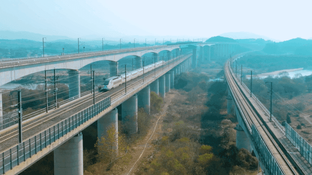 High-speed train crossing a bridge