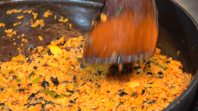 Fried rice spread thin on iron plate