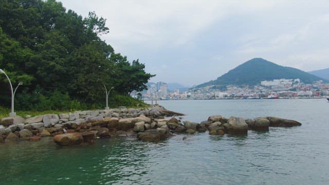 Coastal view with city and mountains