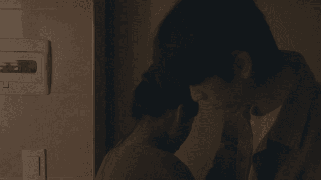 Drunk man hugging woman