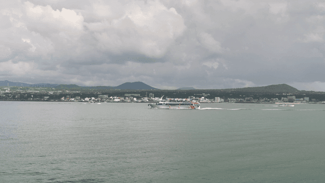 Ferry sailing near coastal town
