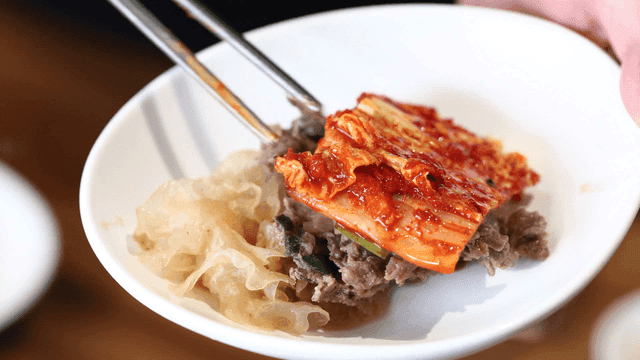 Plate containing bulgogi and kimchi