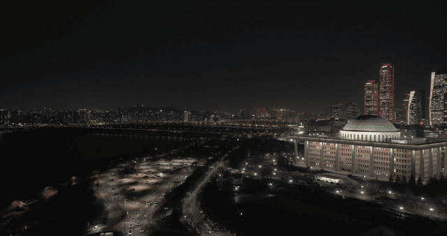 Night view of city with skyscrapers and national buildings