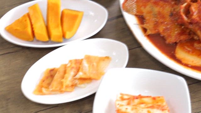 Korean food on the table with spicy assorted braised fish