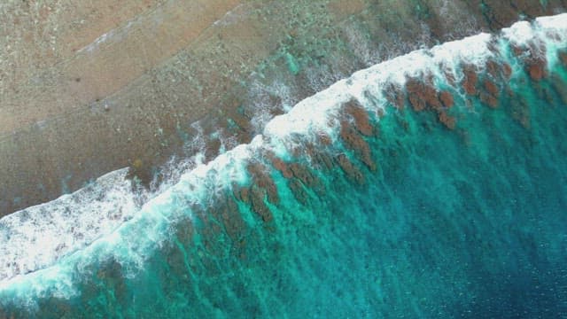 Waves crashing on a sandy beach