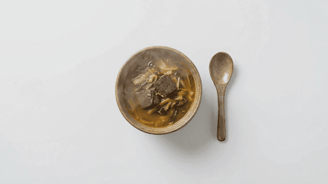 Steaming blood soup with spoon